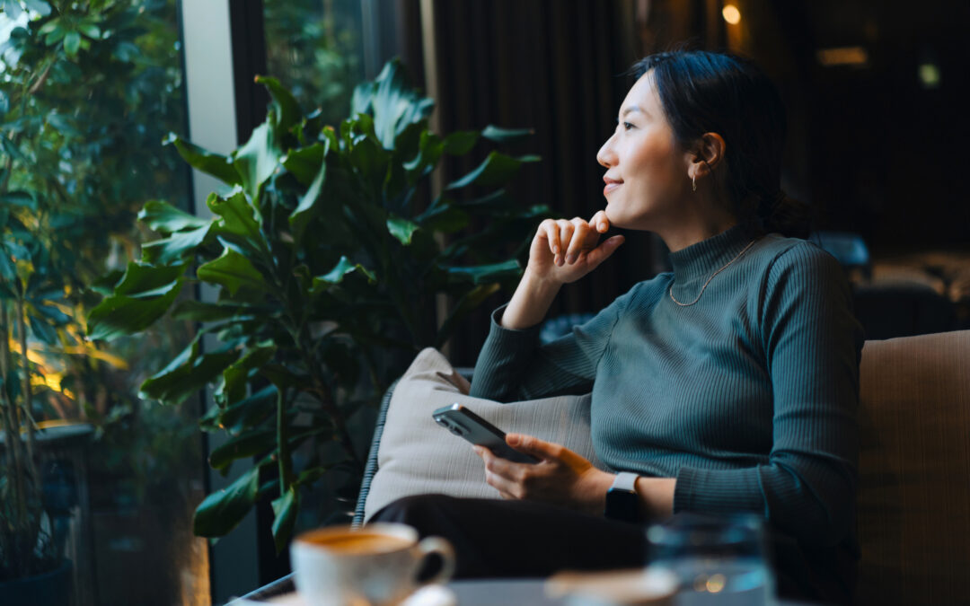 asian woman looking peaceful with device - accessibility blog